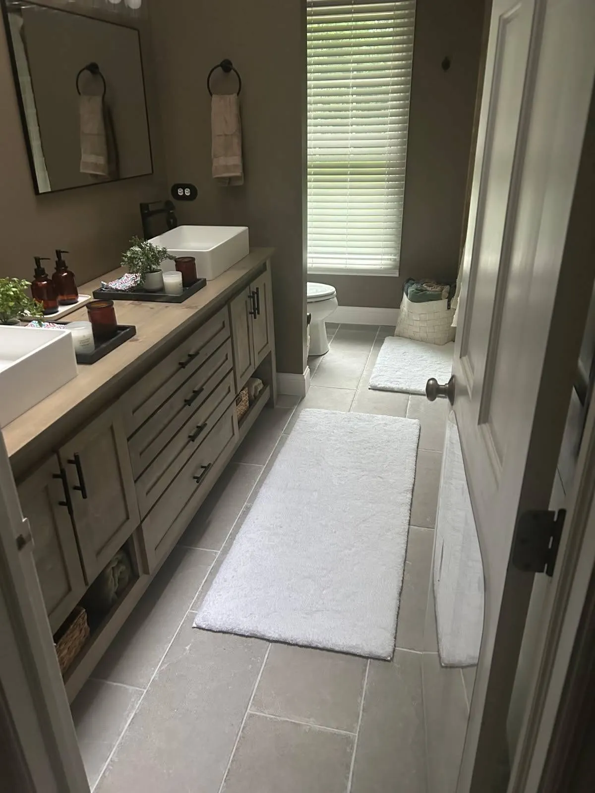 Gray bathroom remodel with tile shower
