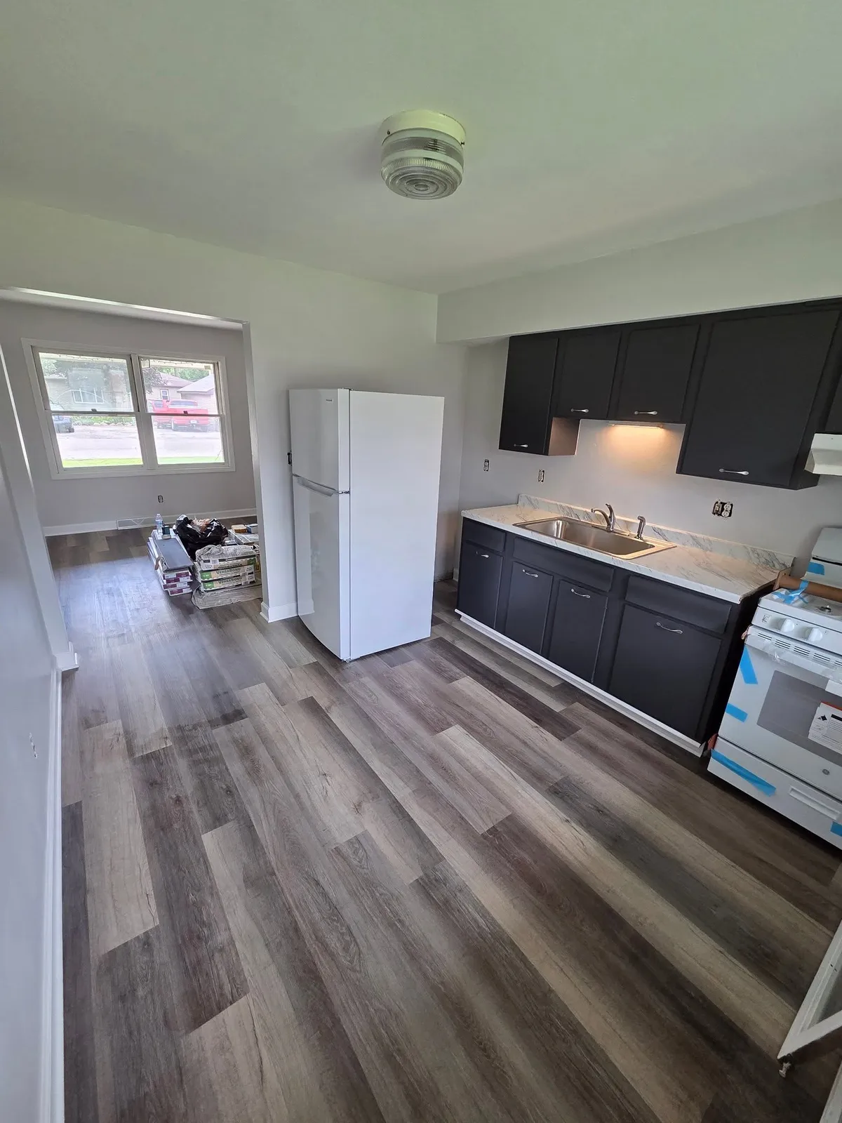Kitchen with black cabinets after remodel