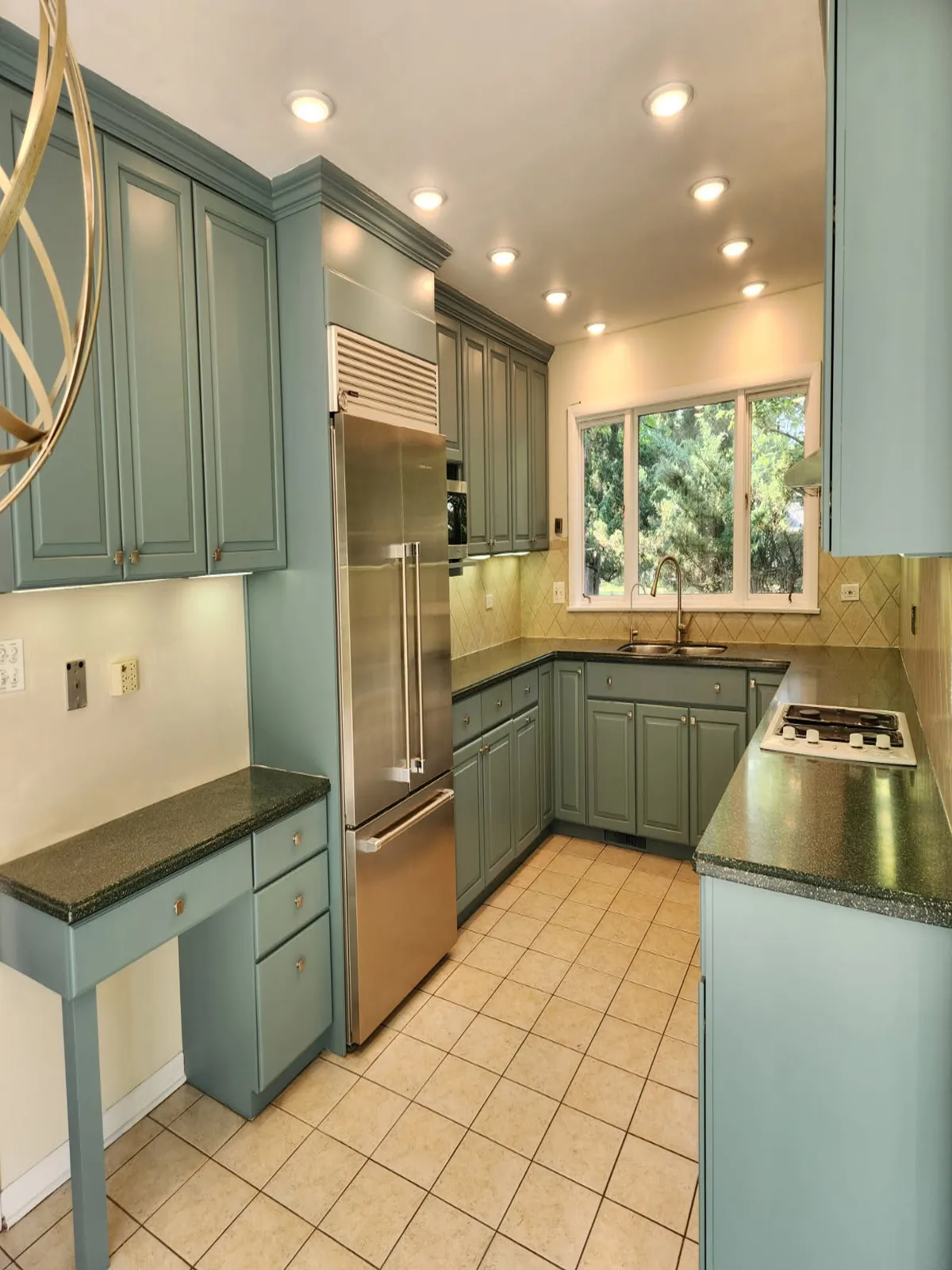 Turquoise kitchen remodel with white countertops